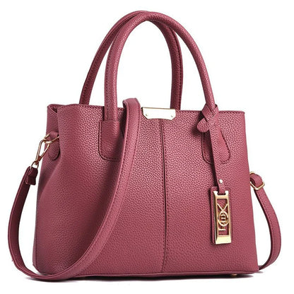 A stylish one-shoulder tote bag in various colours, made of premium polyester with an adjustable strap and spacious interior for the modern professional woman.