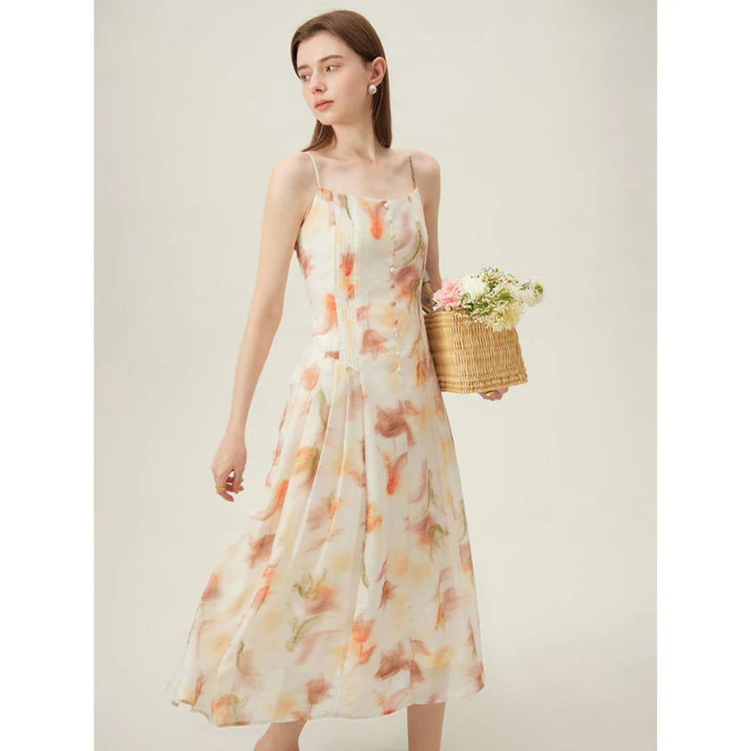Floral sleeveless summer dress with A-line silhouette and vibrant orange print, perfect for British summer occasions