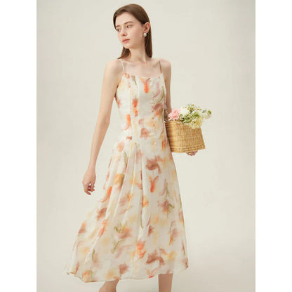 Floral sleeveless summer dress with A-line silhouette and vibrant orange print, perfect for British summer occasions