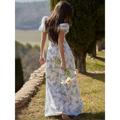 Elegant long maxi summer dress in blue with a flattering fit and flare silhouette, perfect for parties and nights out.