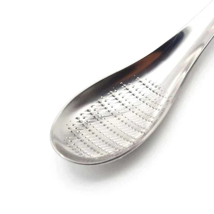 Premium stainless steel multi-purpose grater with ergonomic handle for easy grating and shredding in the modern British kitchen