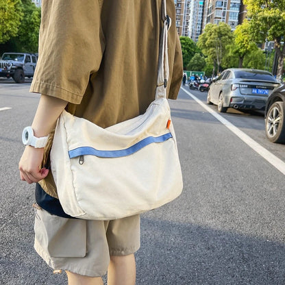 A stylish and durable canvas tote bag with a spacious interior and a timeless vintage-inspired design, perfect for everyday use and travel