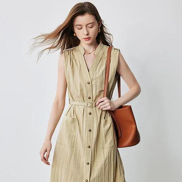 Elegant sleeveless midi shirt dress with V-neck and side pockets, perfect for summer in the UK