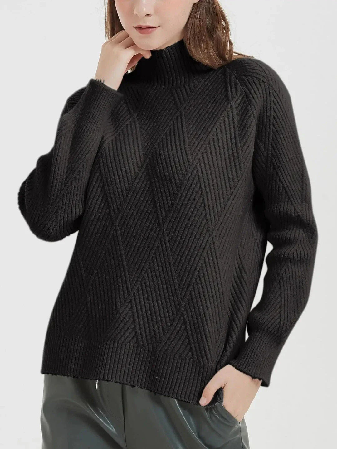 A cosy and stylish knitted turtleneck sweater in a classic beige colour, perfect for layering during the autumn and winter seasons.