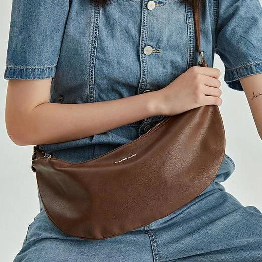 Stylish leather crossbody fanny pack with vintage half-moon design, perfect for everyday use in the UK