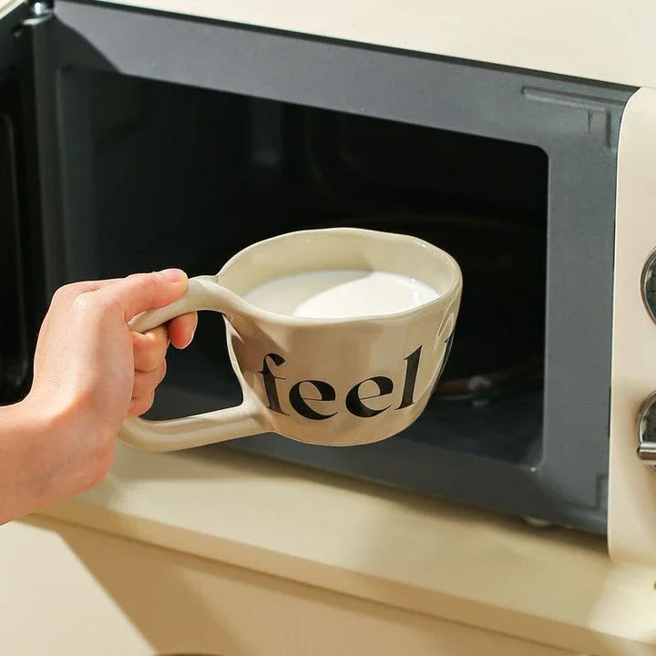 Handcrafted creative alphabet ceramic mug in beige, purple, and khaki colours for hot drinks like coffee and tea