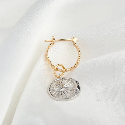 Elegant sterling silver sun and moon earrings with a refined geometric design