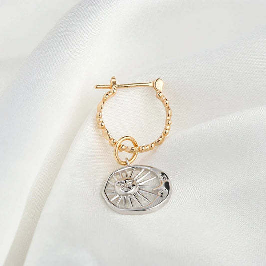 Elegant sterling silver sun and moon earrings with a refined geometric design