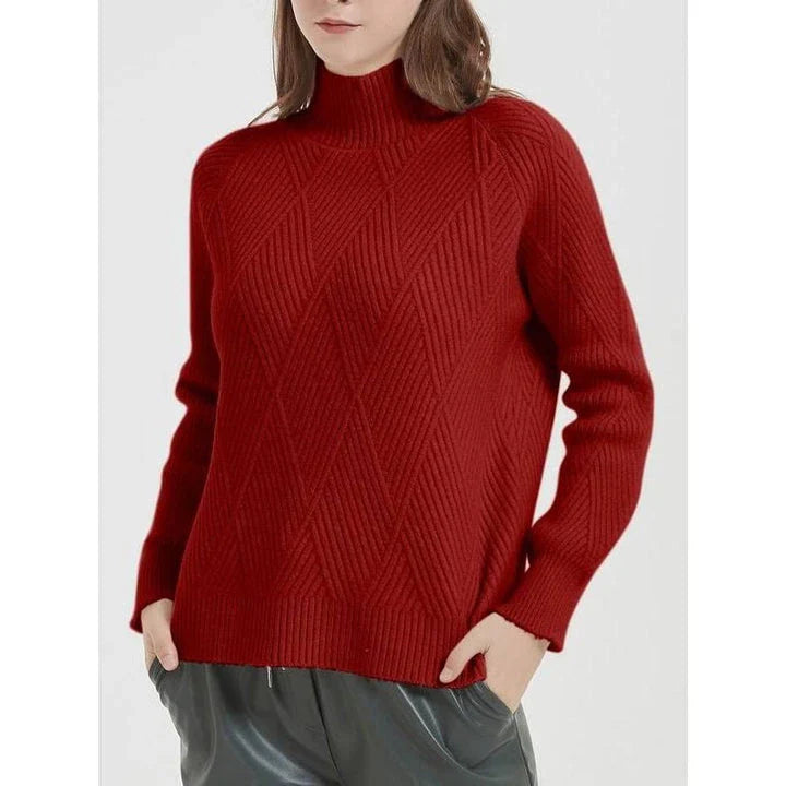 A cosy and stylish knitted turtleneck sweater in a classic beige colour, perfect for layering during the autumn and winter seasons.