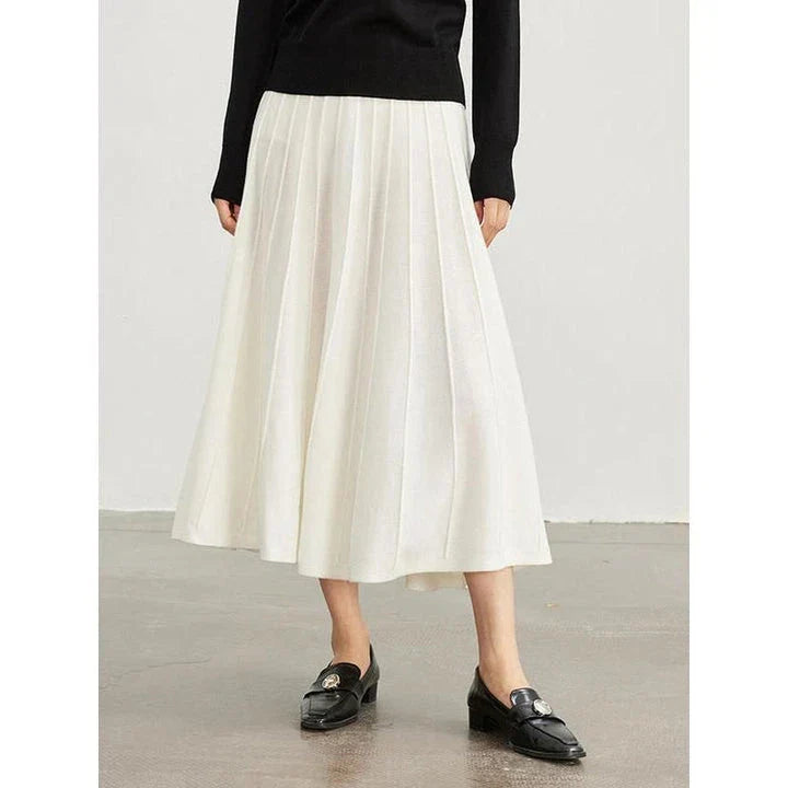 Elegant mid-calf pleated wool skirt in a classic chocolate colour, perfect for the modern British woman's autumn and winter wardrobe.