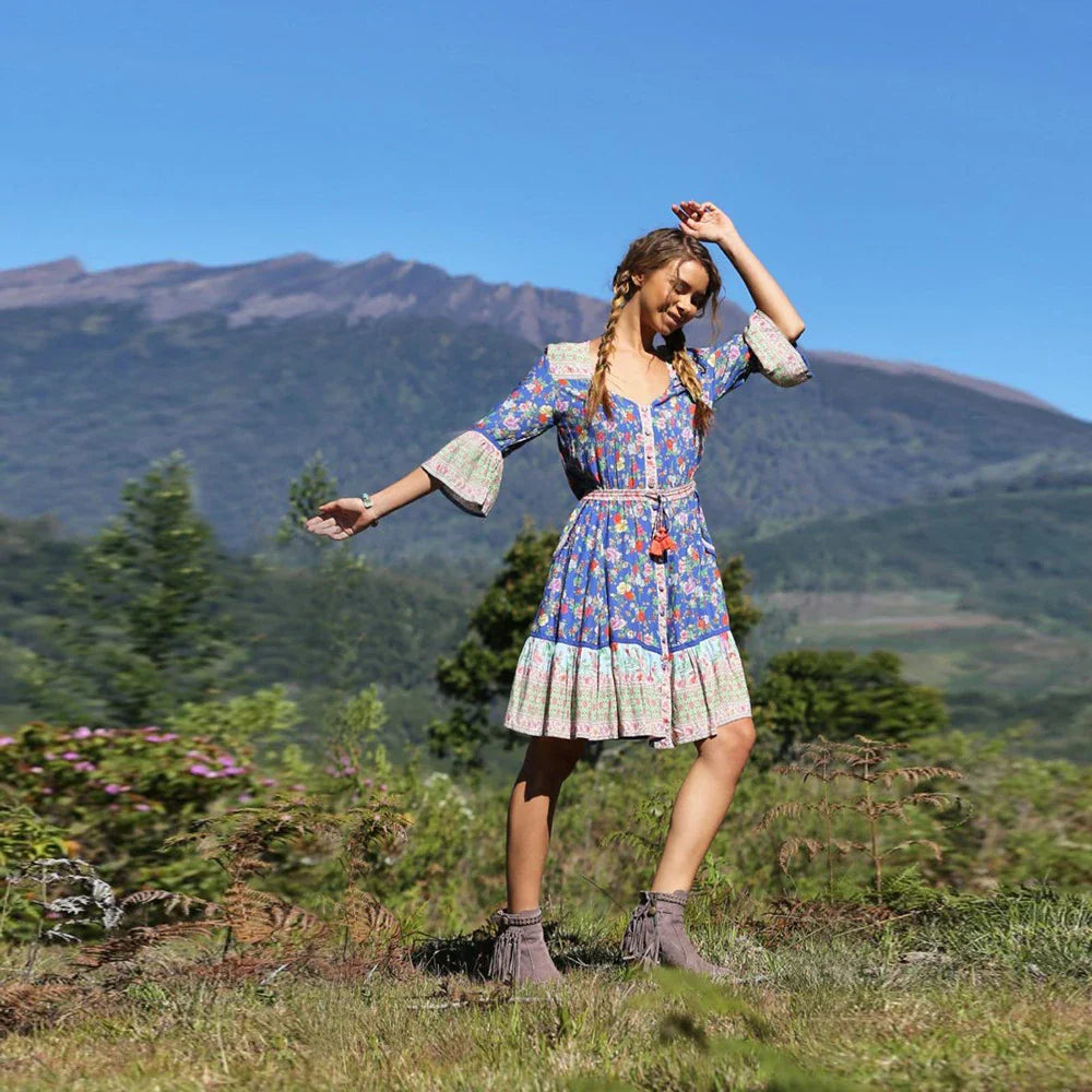 Elegant Bohemian-inspired pleated print dress in a vibrant pink colour, perfect for a day at the British seaside resort.
