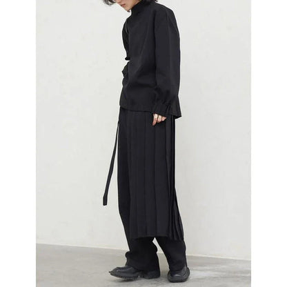 Fashionable pleated sweatshirt and wide-leg trousers set in grey, featuring a relaxed, comfortable silhouette and modern design.