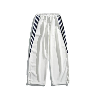 Stylish striped sports trousers in a relaxed, mid-waist design for versatile leisure and athletic wear