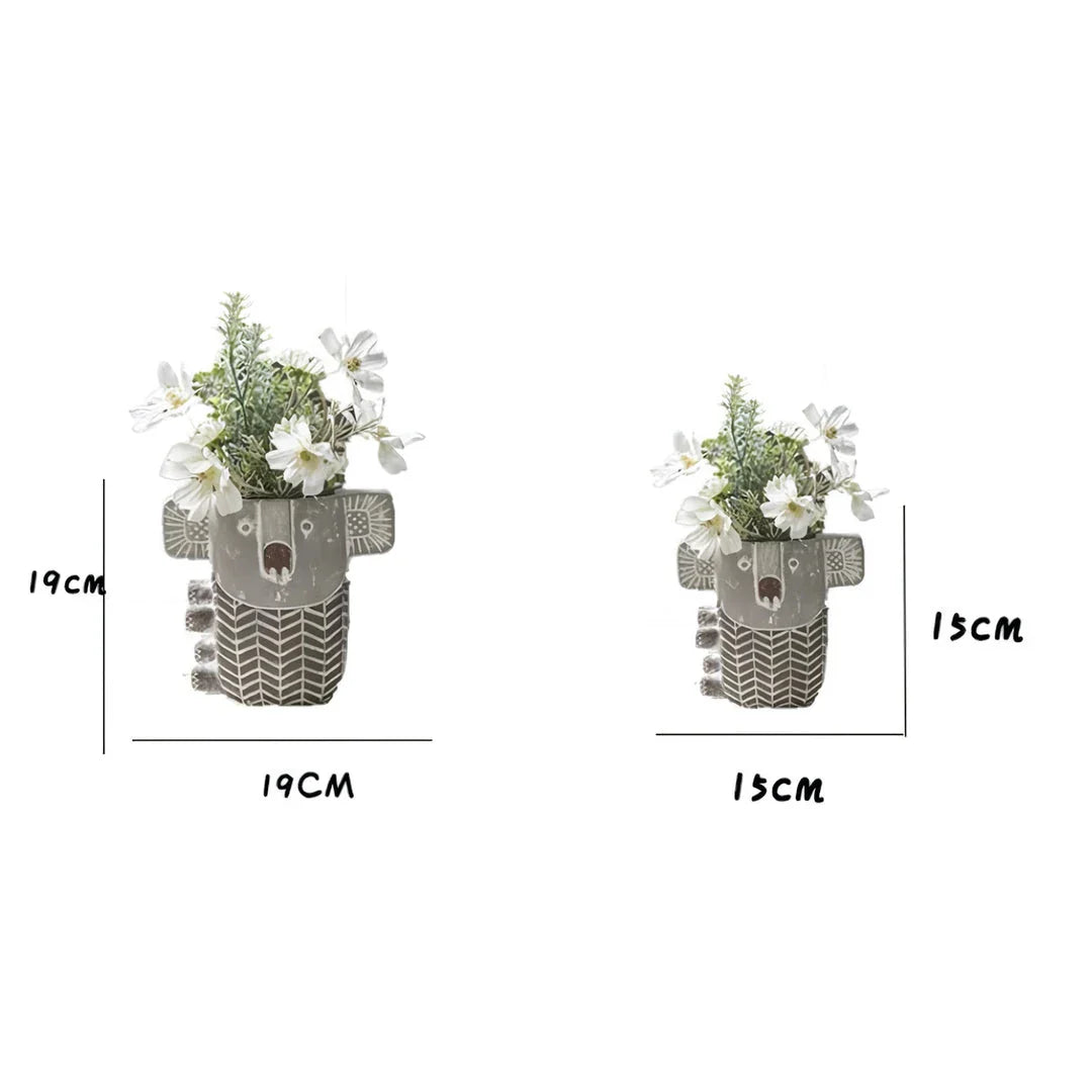 Charming retro koala-shaped cement planter for succulents and small flowers, available in two sizes