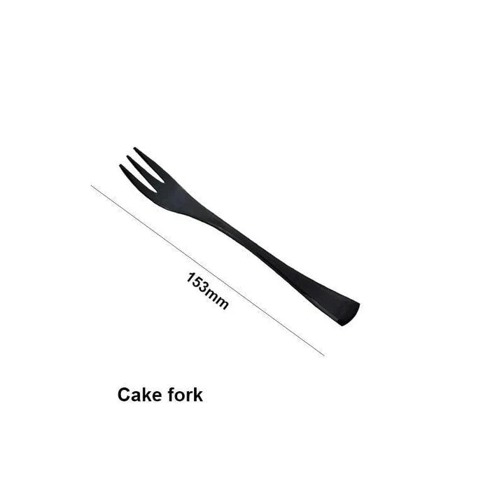 A stylish set of black stainless steel flatware, including a teaspoon, knife, and fork, on a white background.