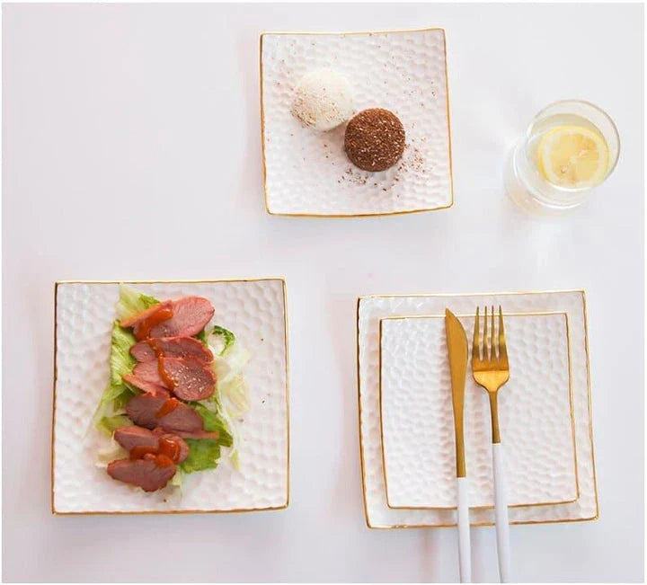 Elegant embossed ceramic cake plate in white, perfect for serving desserts and platters.