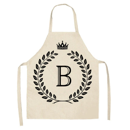 A high-quality kitchen apron featuring a charming crown and letter print design in a premium cotton and linen blend fabric.