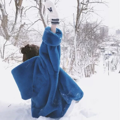 A stylish navy blue faux fur rabbit coat with a hooded design and medium length, perfect for staying warm and fashionable in the UK.