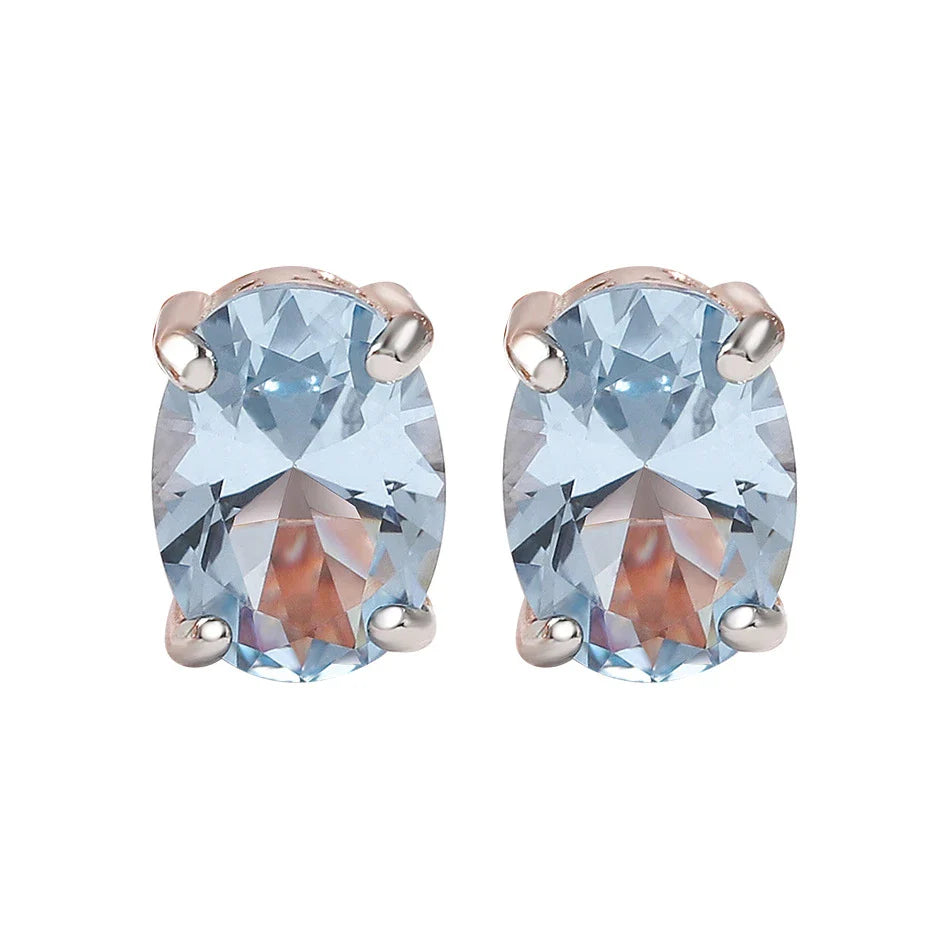 Geometrically simple sterling silver earrings in a rose gold finish, showcasing a minimalist and elegant design