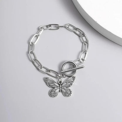 Silver butterfly pendant bracelet with a delicate chain and charming bowknot design