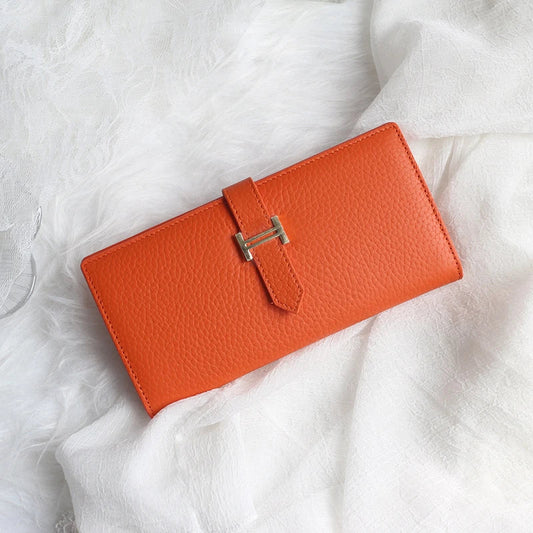 A stylish and practical long wallet made from premium leather, featuring a convenient drawstring closure to keep your essentials organised and secure.