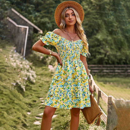 A stylish one-shoulder mini dress with a vibrant floral print, ruffle detailing, and an A-line silhouette.