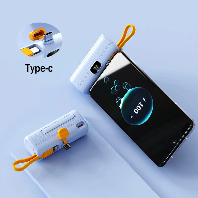 Compact, high-capacity power bank with dual charging ports and built-in cables for convenient, fast charging on the go