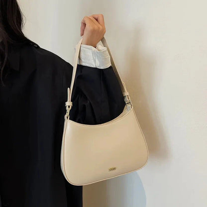 Luxury red leather crossbody bag with sleek design and elegant details