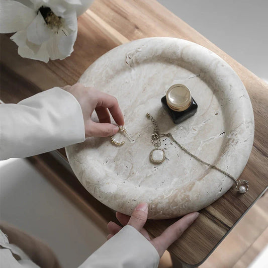 Elegant travertine serving tray with a smooth, round design and neutral beige colour for versatile home decor use
