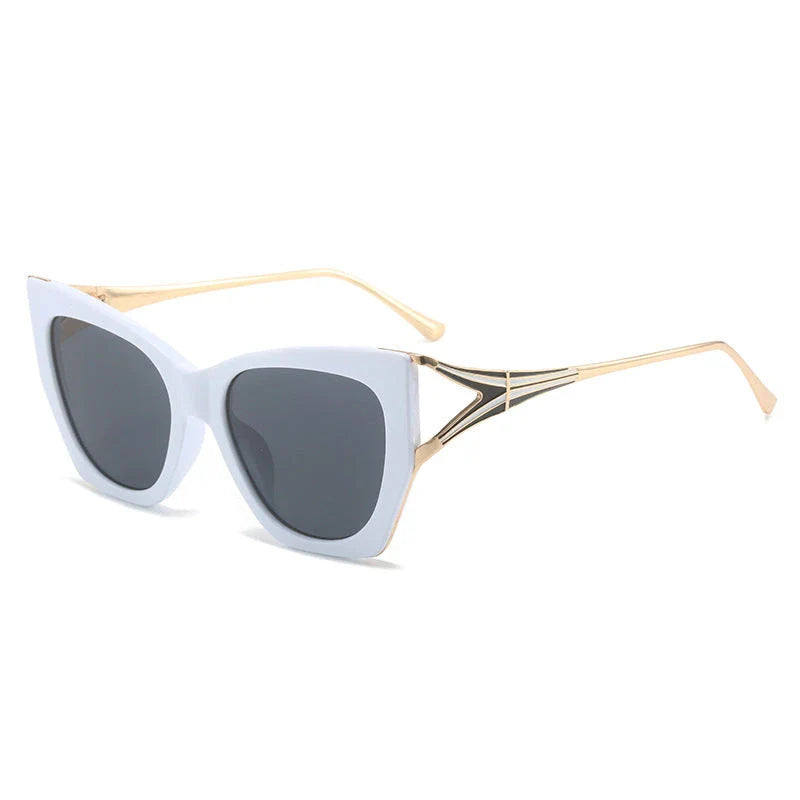Refined cat eye sunglasses with blue gradient lenses and sleek metal frames, offering timeless British style and UV400 protection.
