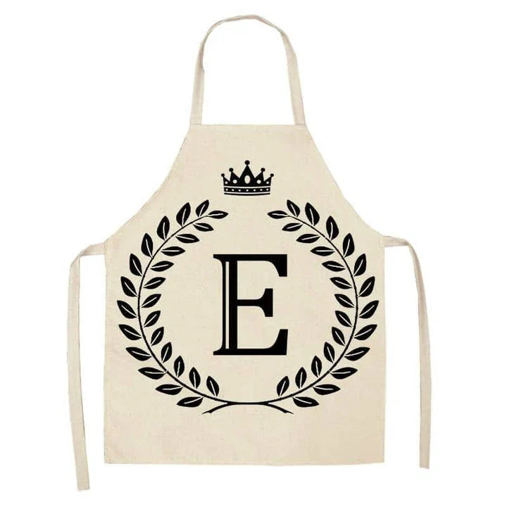 A high-quality kitchen apron featuring a charming crown and letter print design in a premium cotton and linen blend fabric.