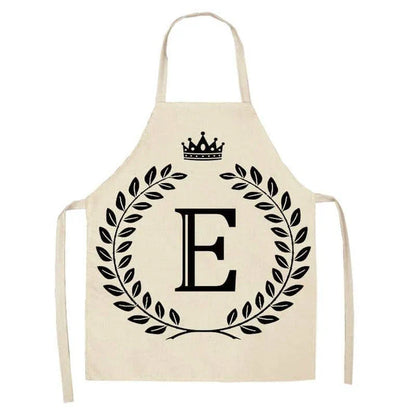 A high-quality kitchen apron featuring a charming crown and letter print design in a premium cotton and linen blend fabric.
