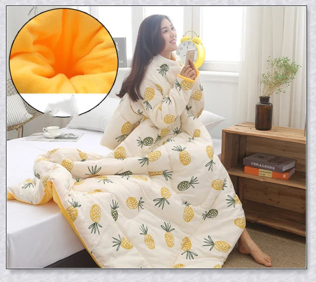A cosy, wearable quilt with sleeves in a variety of colourful designs, perfect for staying warm and comfortable during the winter months.