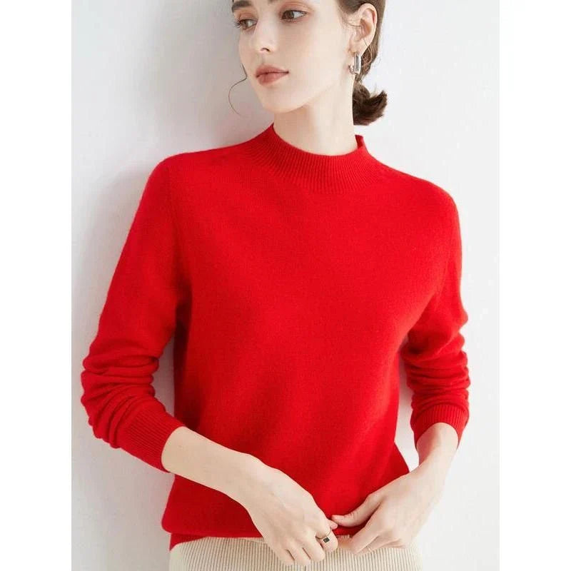 A woman wearing a luxurious Merino wool mock-neck jumper in a stylish autumnal outfit