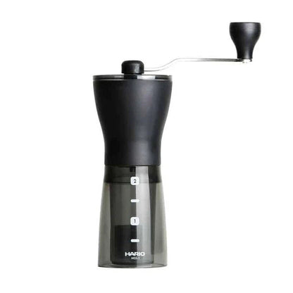 Stylish powder coffee grinder in black and red, with a manual grinding mechanism for consistent and freshly ground coffee.