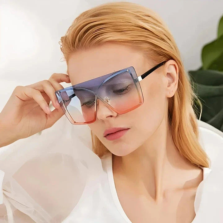 Fashionable oversized flat top sunglasses with gradient lenses and a sleek, rimless plastic frame