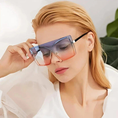 Fashionable oversized flat top sunglasses with gradient lenses and a sleek, rimless plastic frame