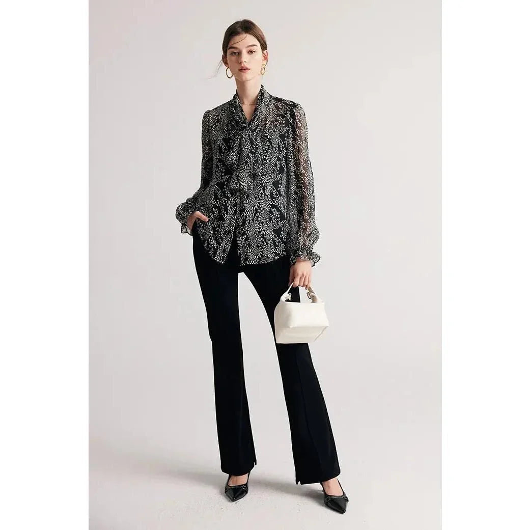 Elegant black silk blouse with unique bow collar, designed for a flattering fit and all-day comfort.