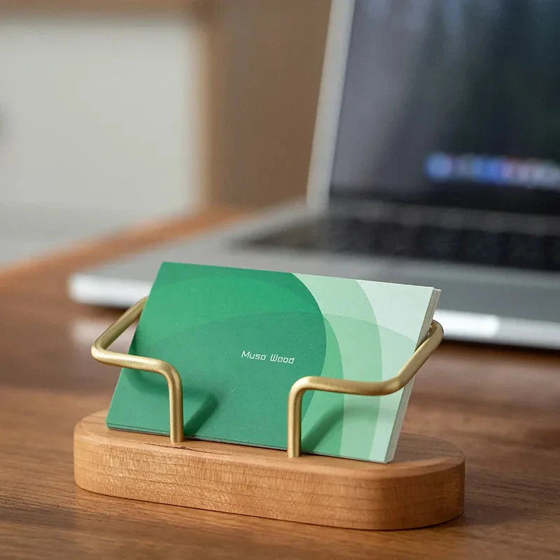 Elegant wooden business card holder made of premium black walnut or beech wood, designed for use on office desks and in home workspaces.
