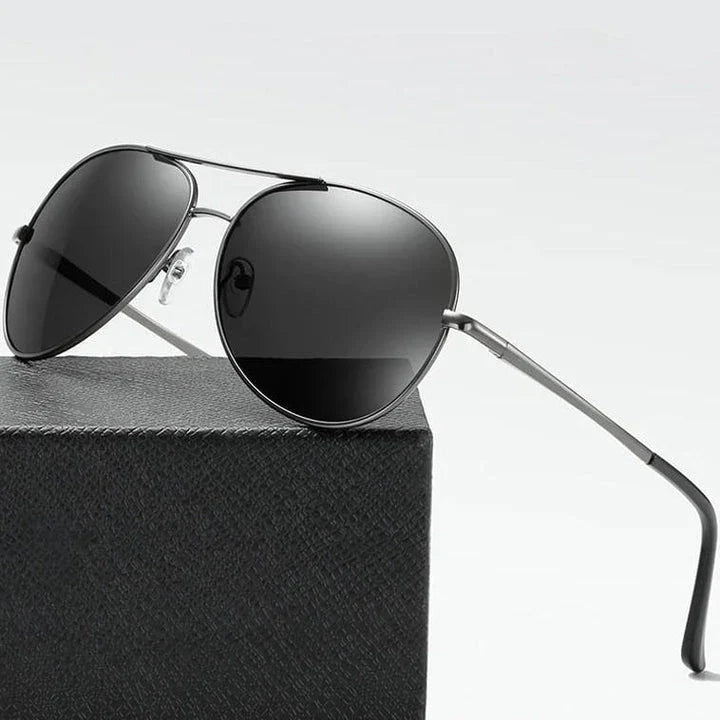 Photochromic Pilot Sunglasses with silver lenses that adjust tint based on light conditions
