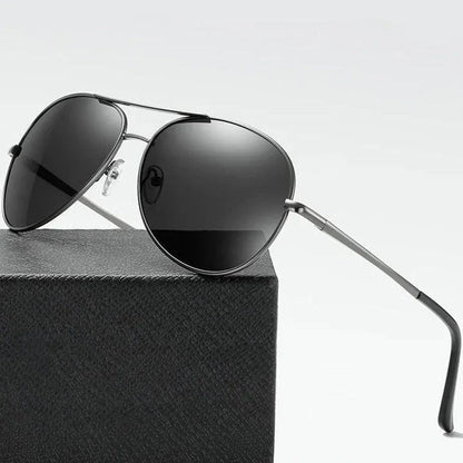 Photochromic Pilot Sunglasses with silver lenses that adjust tint based on light conditions