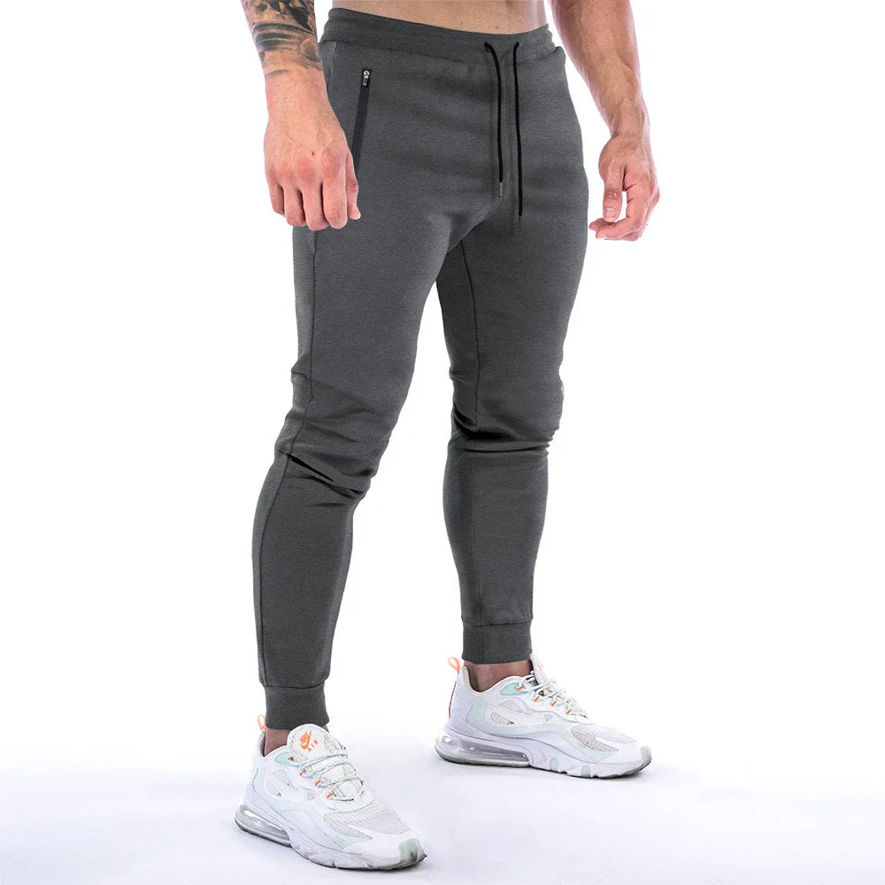 Premium athleisure trousers for stylish British men, featuring a refined sports-inspired design, breathable cotton construction, and a sleek, slim-fit silhouette.