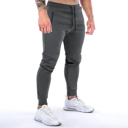 Premium athleisure trousers for stylish British men, featuring a refined sports-inspired design, breathable cotton construction, and a sleek, slim-fit silhouette.