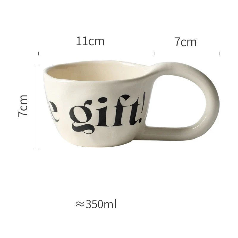Handcrafted creative alphabet ceramic mug in beige, purple, and khaki colours for hot drinks like coffee and tea