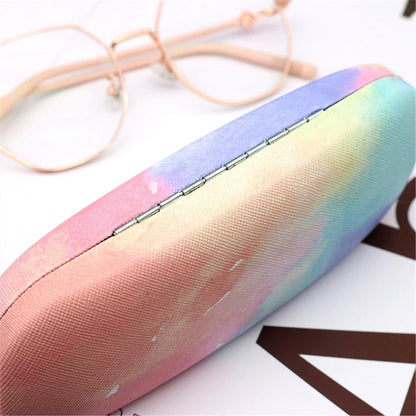 Gradient cloud printed eyewear case with metal frame and PU leather construction, protecting glasses from scratches and everyday wear and tear