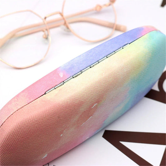 Gradient cloud printed eyewear case with metal frame and PU leather construction, protecting glasses from scratches and everyday wear and tear