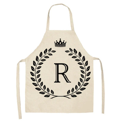 A high-quality kitchen apron featuring a charming crown and letter print design in a premium cotton and linen blend fabric.
