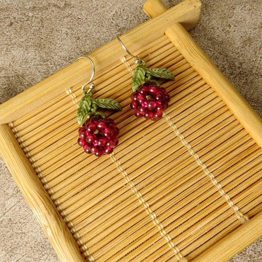 Vintage-style raspberry lacquer earrings with garnet accents, showcasing a charming fruit-shaped silhouette and a captivating retro-inspired design.
