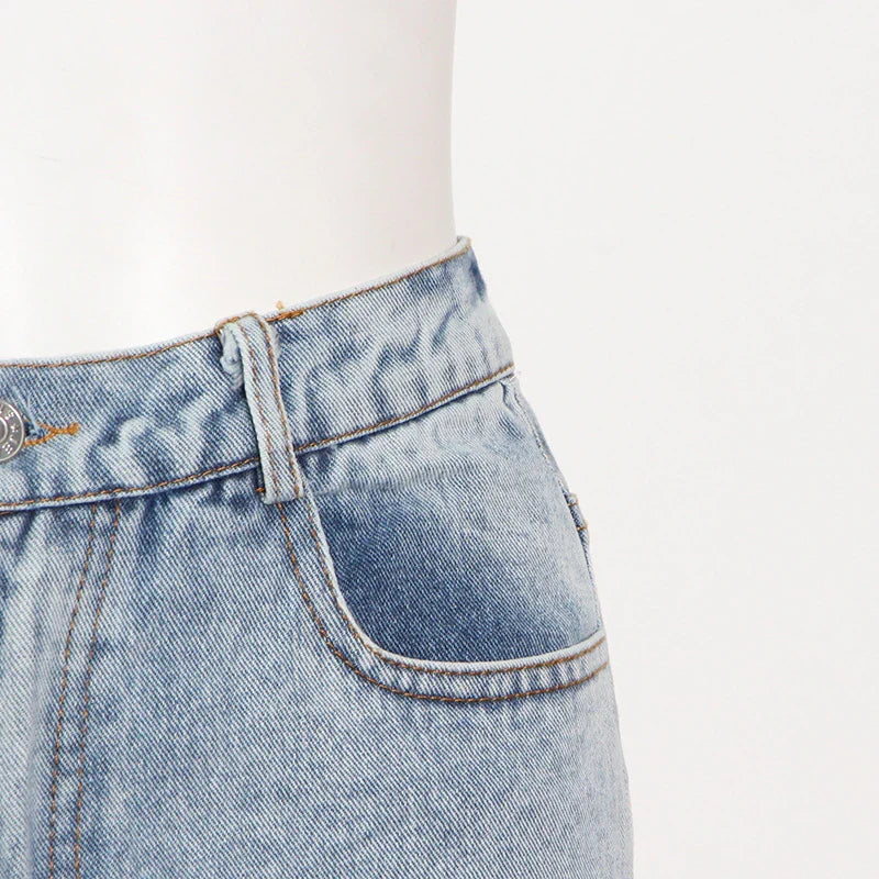 High-waisted wide-leg denim trousers in a stylish blue colour, featuring a comfortable and flattering fit