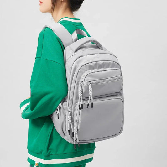 Premium leather backpack with dedicated laptop compartment, soft handles, and arcuate shoulder straps for modern women